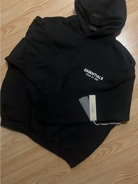 Fear of God ESSENTIALS Black Hoodie with White Chest Print
